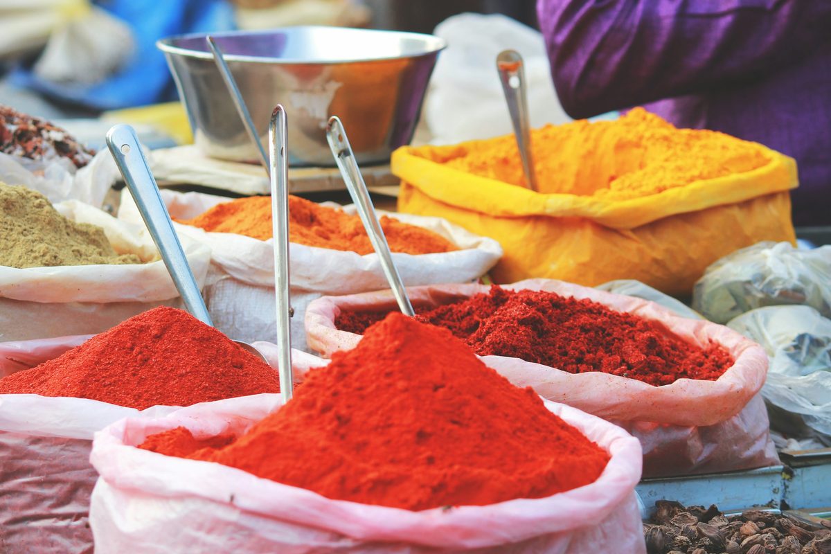 Mounds of turmeric, chilli and spices at a market stall
